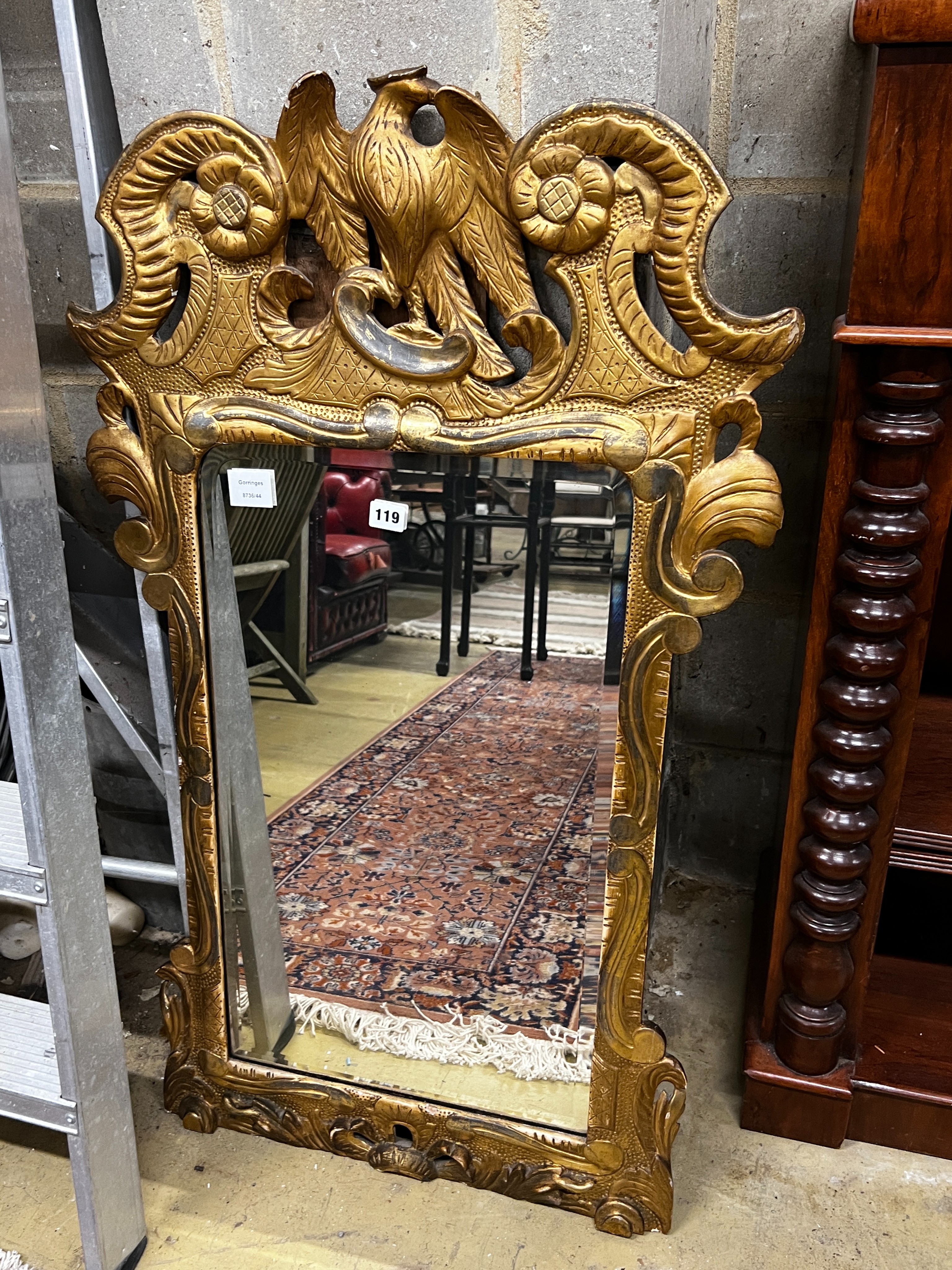 An 18th century style carved giltwood wall mirror, width 62cm, height 105cm
